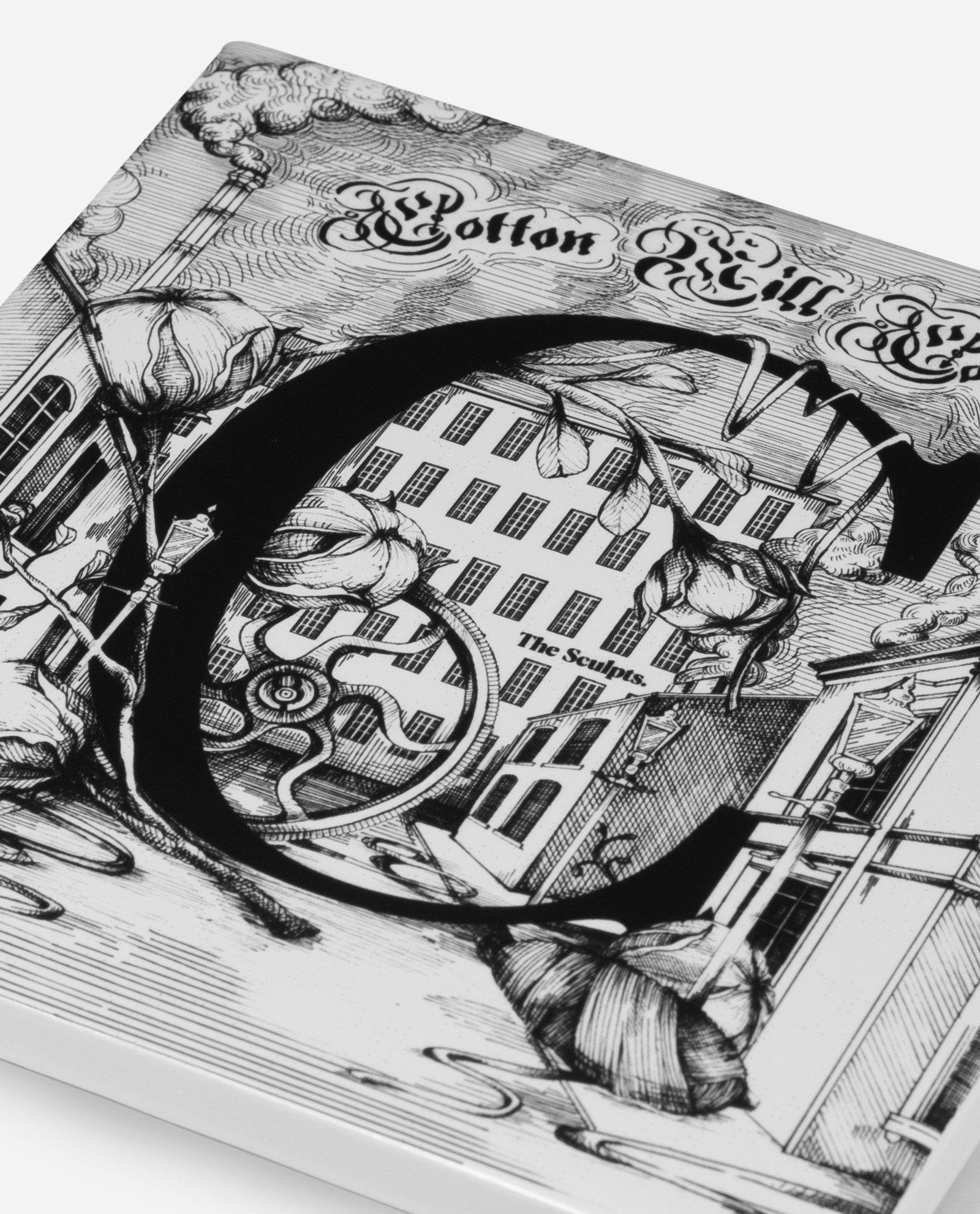 Close-up detail of Manchester ceramic tile Letter C showing Cotton Mill Company Victorian architecture and ornate typography