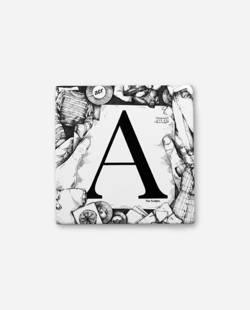 Affleck's Palace ceramic tile featuring black letter A on white with detailed pen and ink border illustrations by The Sculpts