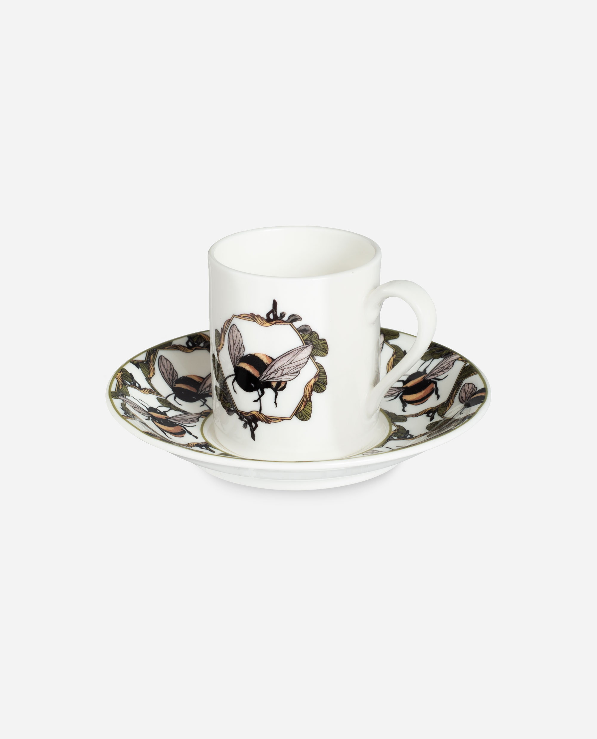 Honeycomb Bee espresso cup and saucer by The Sculpts showing white porcelain with illustrated bees and leaves in tan and olive