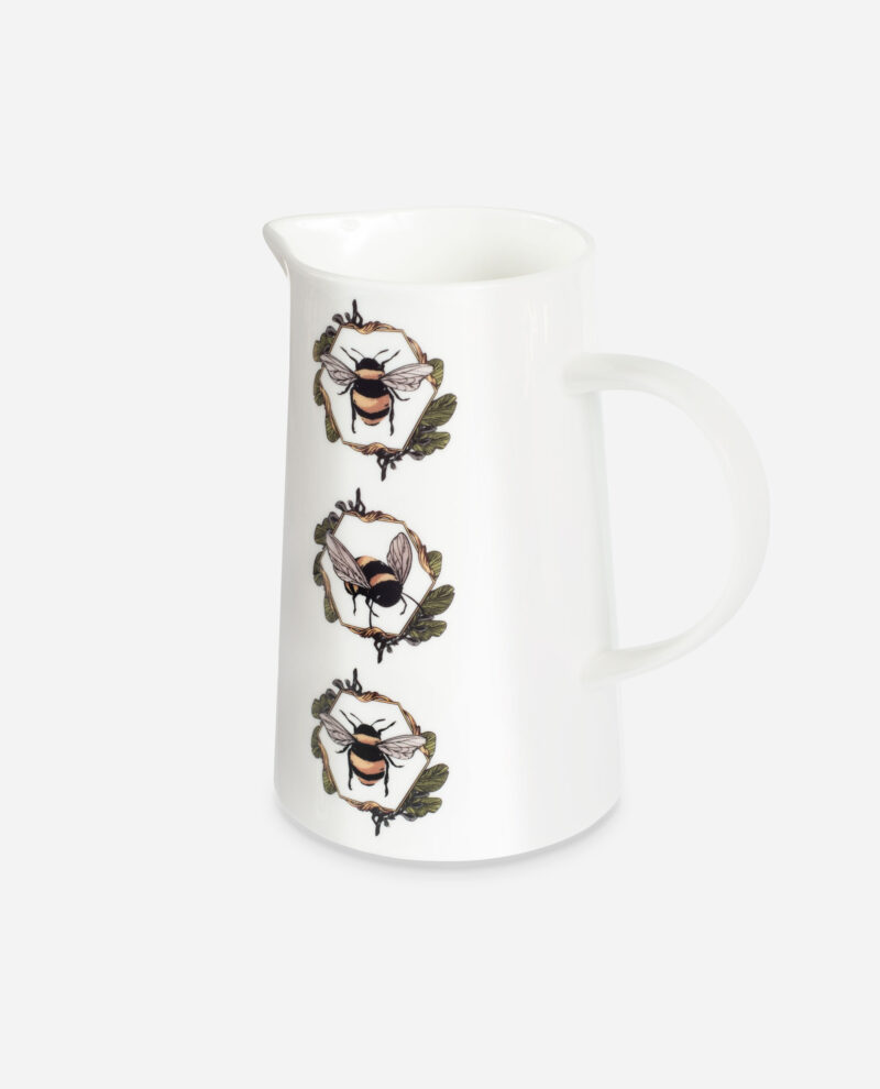 White bone china Honeycomb Bee Jug by The Sculpts shown at an angle, featuring three bumblebees in circular honeycomb wreaths with oak leaves
