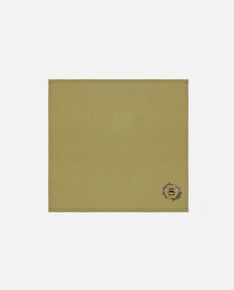 Soft olive green cotton bee napkin with embroidered Honeycomb Bee motif in the corner from The Sculpts